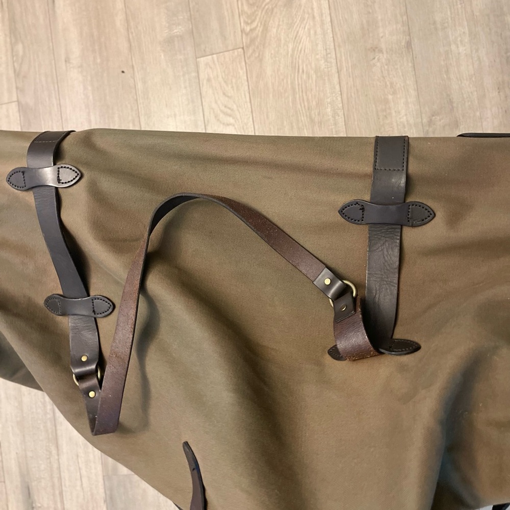 Large Filson Duffle luggage with rollers with lock and key